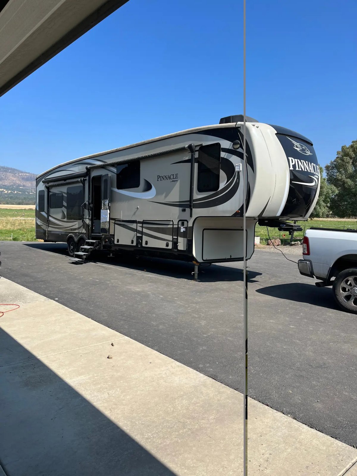 Jayco Pinnacle fifth wheel trailer hitched to a white pickup truck, bought together in California