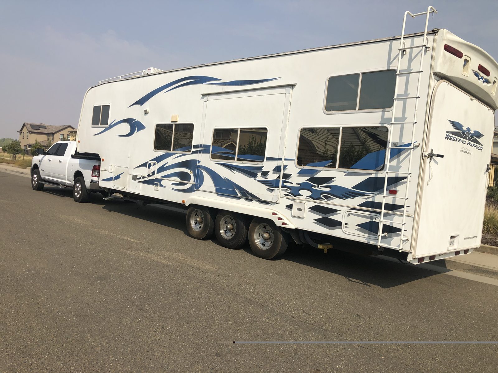 Triple-axle toy hauler fifth wheel purchased for cash in California