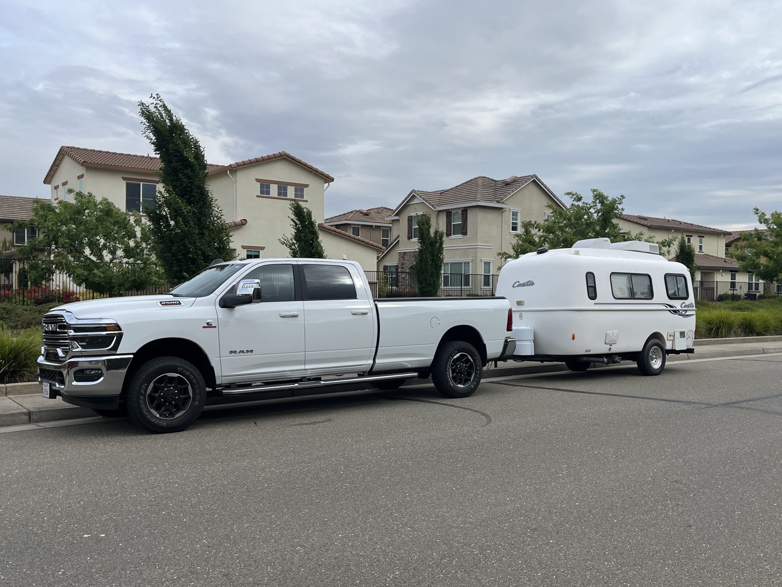 Compact travel trailer and Ram dually pickup purchased together in California